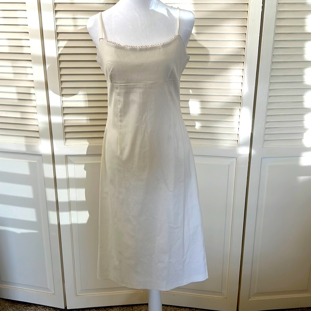 New White sheath dress with lace accent at the neckline